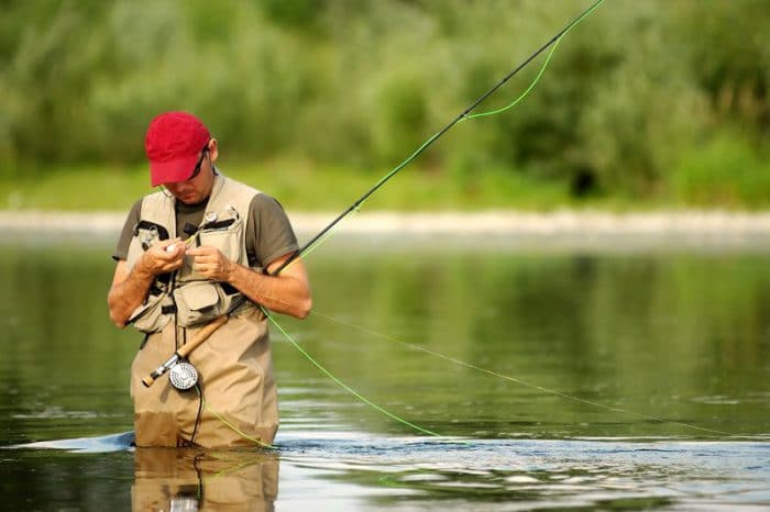 man fly fishing