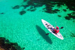 man on kayak fishing